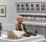 Installation photograph showing gallery view of the exhibition NOT I: Throwing Voices (1500 BCE–2020 CE), including a ventriloquist dummy in a display case