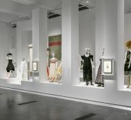 Gallery with dressed mannequins and other art