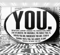 Room-size installation with black and white text on walls and floor, including the word "You"