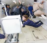 Astronauts floating in space station