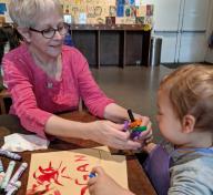 Tracy Newman and grandson Logan in the Boone Children's Gallery, photo credit: Liza Cranis