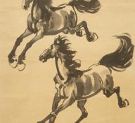 Two painted horses on tan backdrop