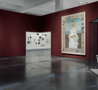 Gallery view with sculpture and paintings