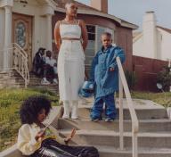 Photo of family on steps in front of house