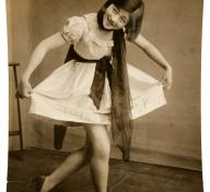 Vintage photo of young woman curtsying 
