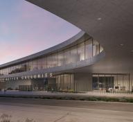 Rendering of exterior view of gray concrete building at dusk