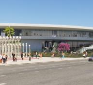 Rendering of street-level view of museum building with outdoor art and visitors