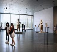 Rendering of visitors in art-filled gallery