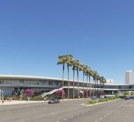 Rendering showing exterior view of gray concrete gallery building and trees and visitors on the ground level