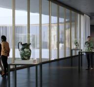 Rendering of visitors in art-filled gallery with floor-to-ceiling windows on the left