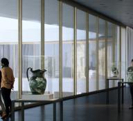Rendering of interior of gallery with visitors and art