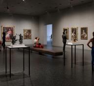 Rendering of gallery interior with visitors viewing European painting and sculpture