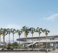 Rendering of exterior of gray horizontal building with palm trees in the foreground