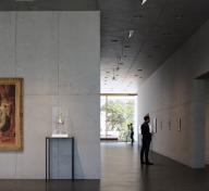 Rendering of gallery with art and visitor