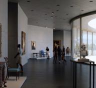 Rendering of gallery with artworks and visitors, with floor-to-ceiling glass on the right