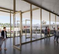Rendering of entrance to art gallery, with visitors and art and a view to the outside