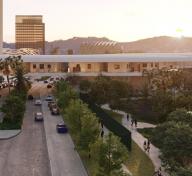 view of a building crossing a street, with walking paths visible