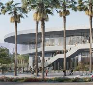 Rendering of gray museum building seen from across the street and framed by tall palm trees