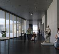 Gallery view with sculptures and floor-to-ceiling windows